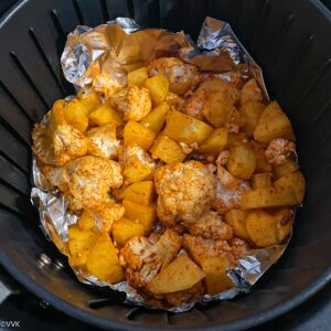 placing the roasted potatoes in to the airfryer