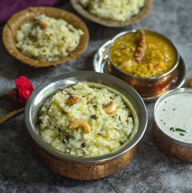 square image of ven pongal served in bowl and leaf bowl along with chutney and sambar