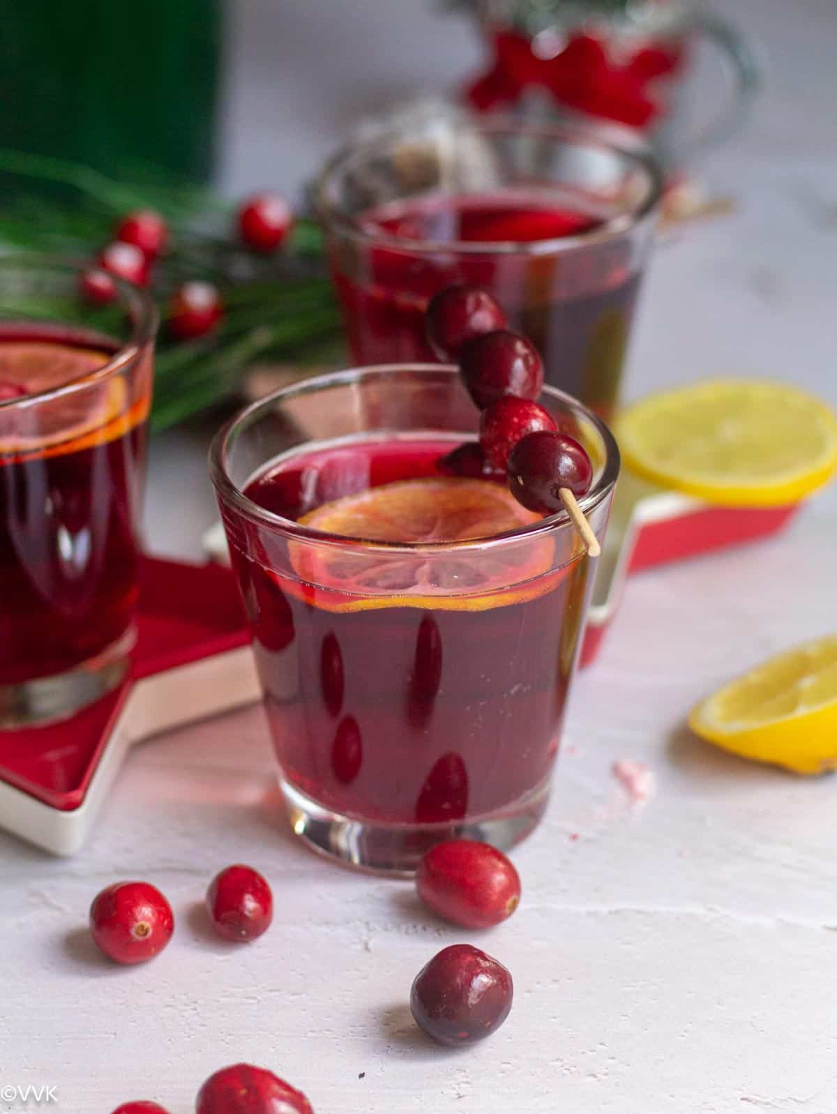 festive special cranberry ginger ale cocktail served with lemon wedges