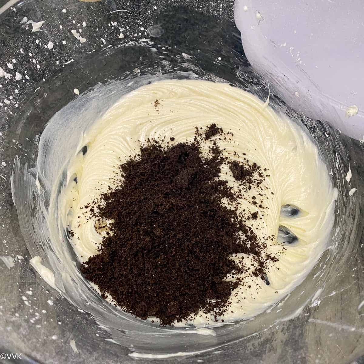 adding the crushed oreo cookies