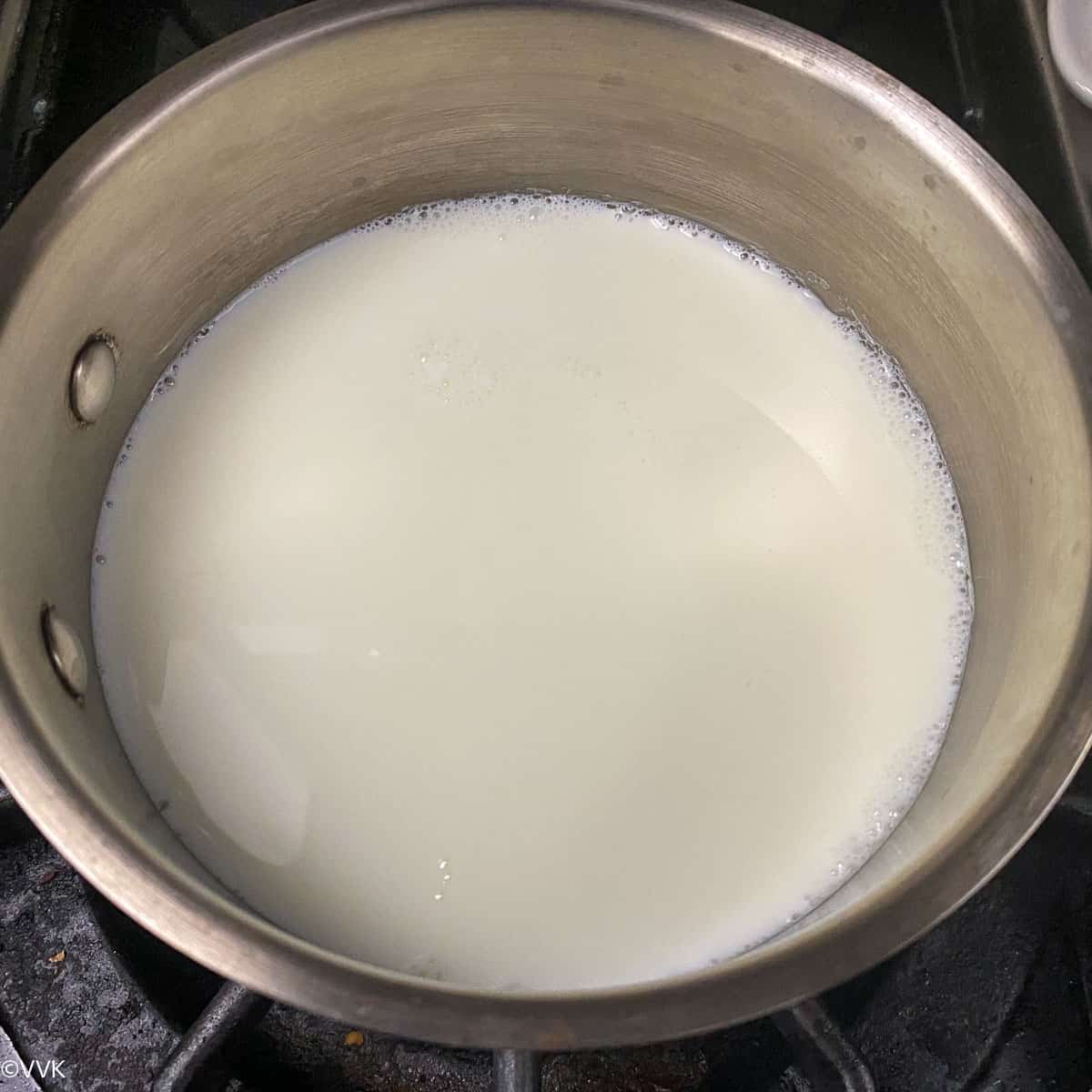 milk simmering in saucepan