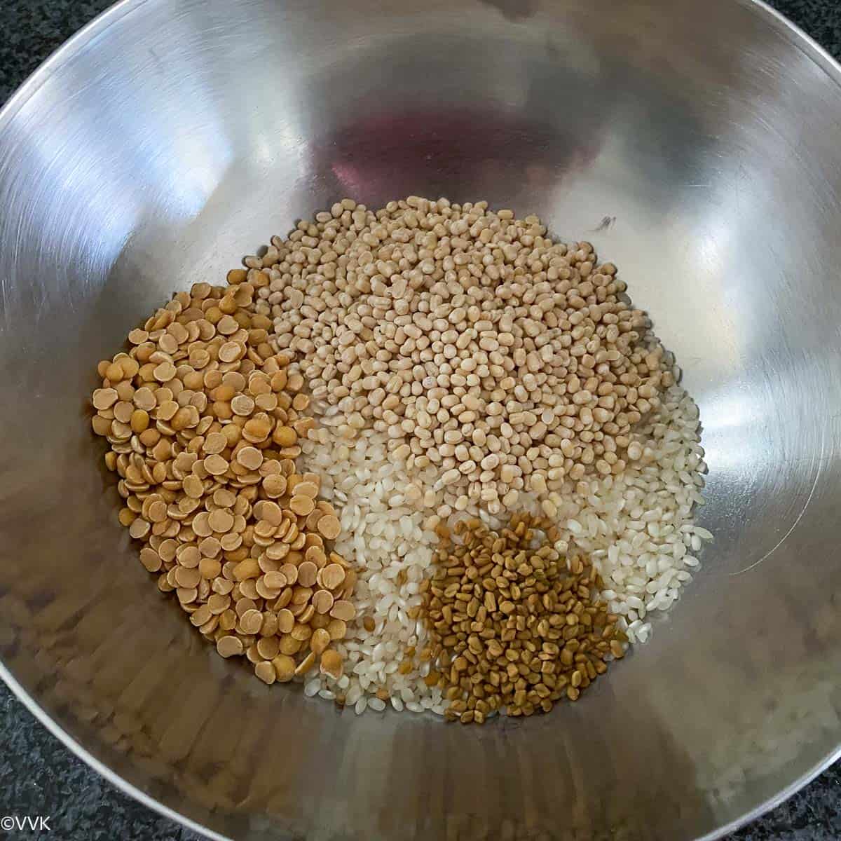 toor dal, fenugreek seeds, idli rice and urad dal in a bowl