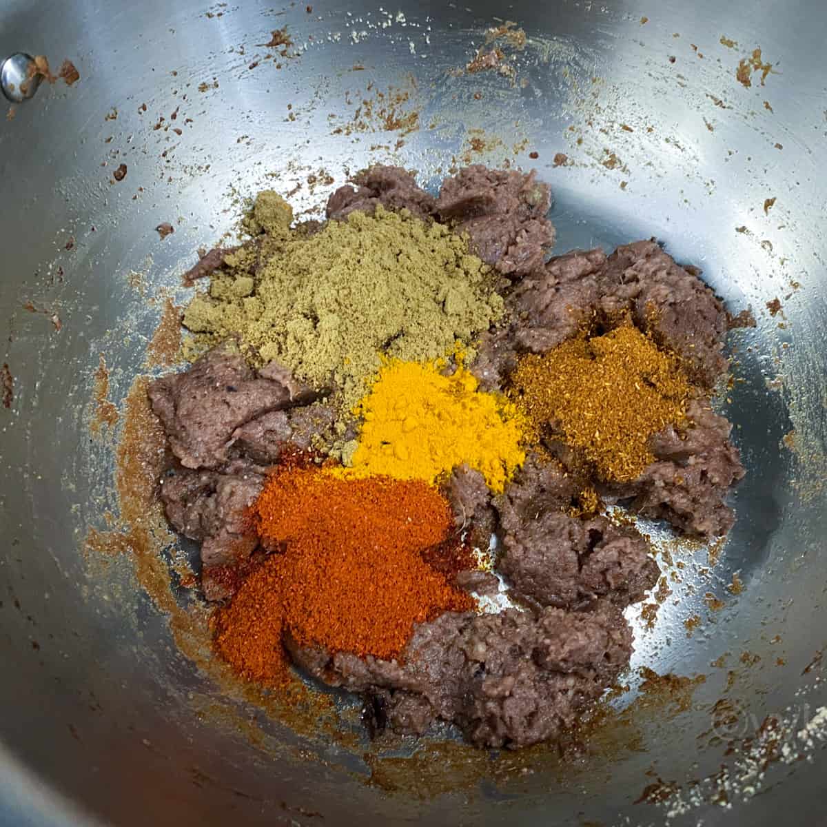 adding all the spice powders