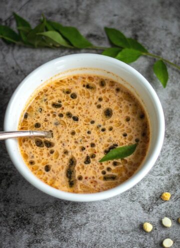 square image of roasted gram chutney served in a white bowl