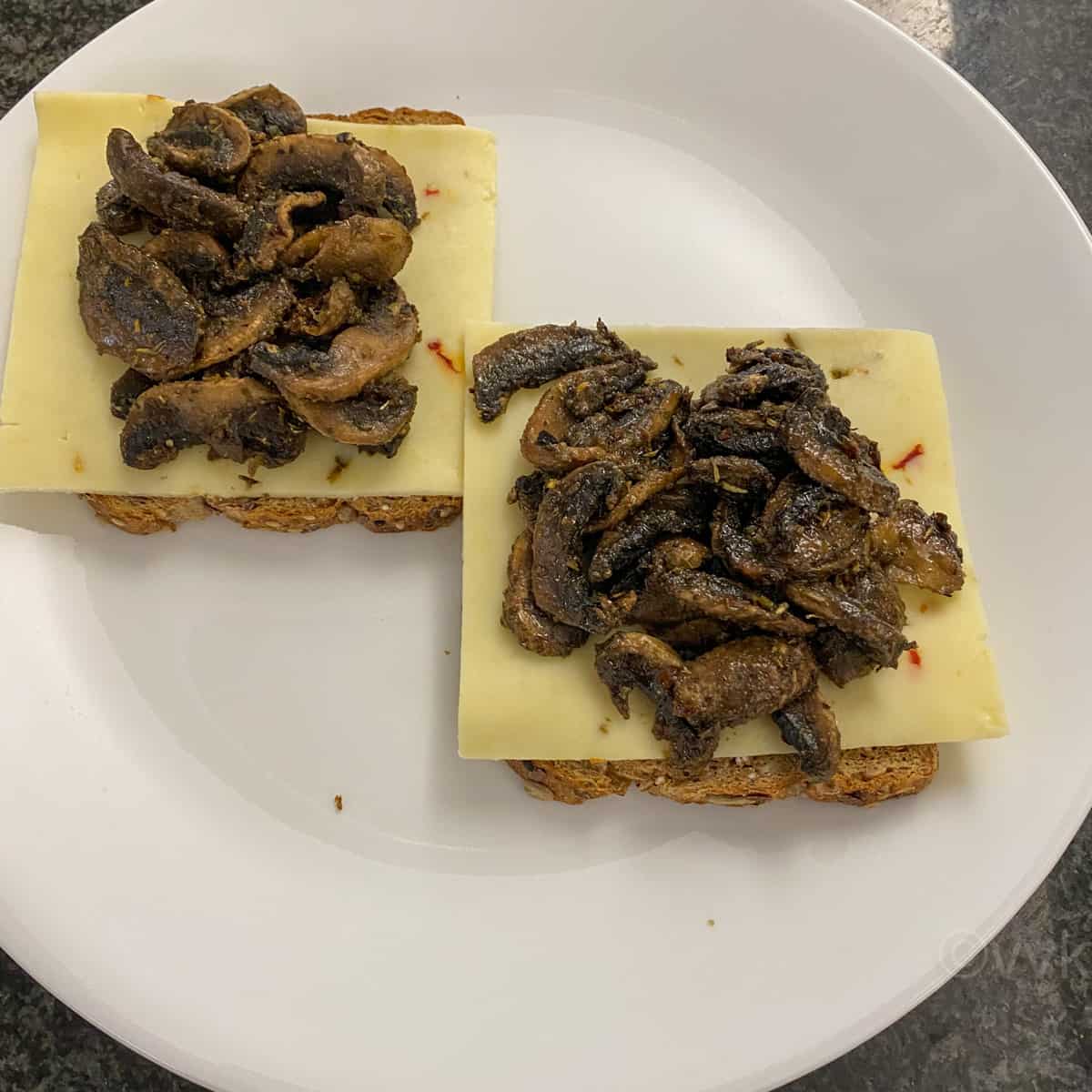 placing the sauteed mushrooms on top