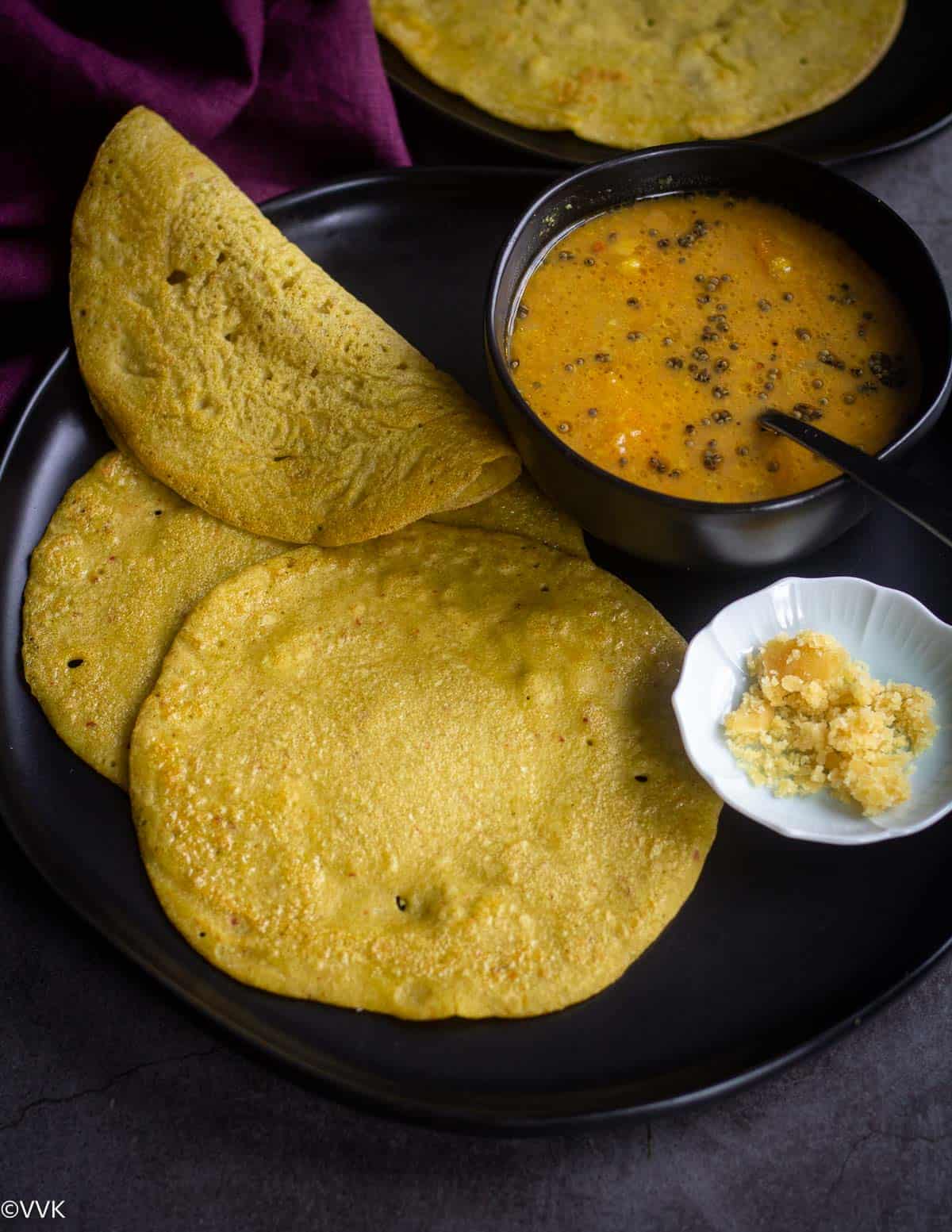 protein rich edamame dosa served with sambar and jaggery served in a plate