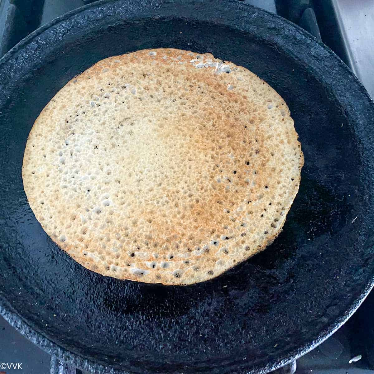 flip the dosa and cook again