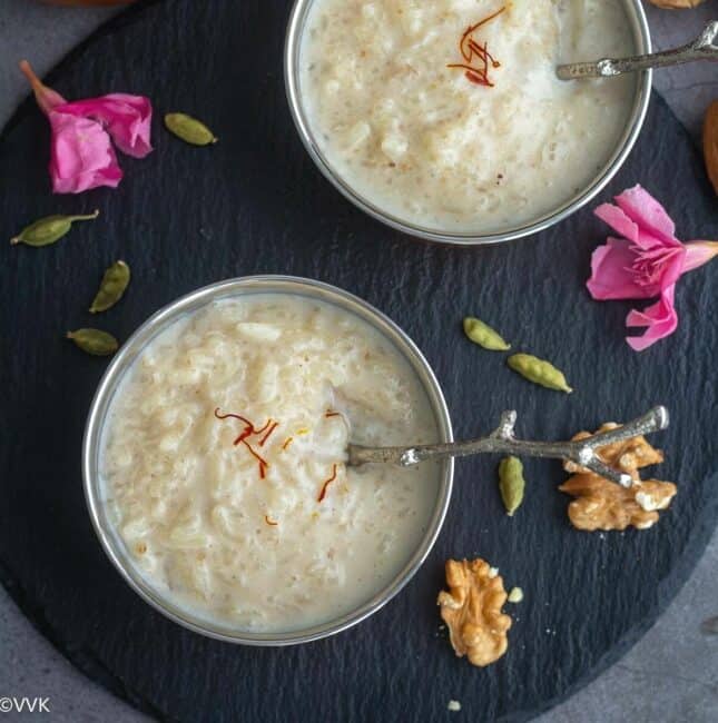 square image of instant pot walnut kheer served in two bowls placed on black slate board