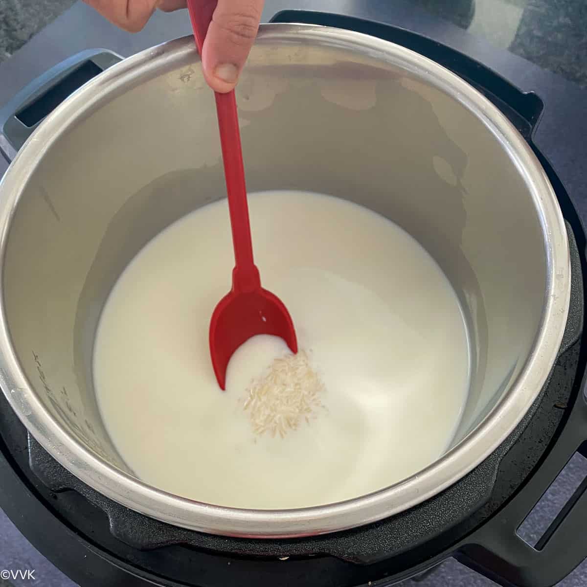 adding rice, milk and sugar into the instant pot
