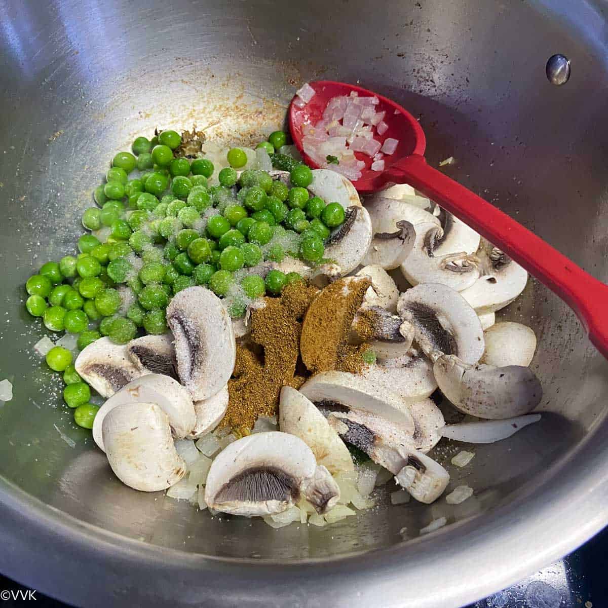adding mushrooms and peas