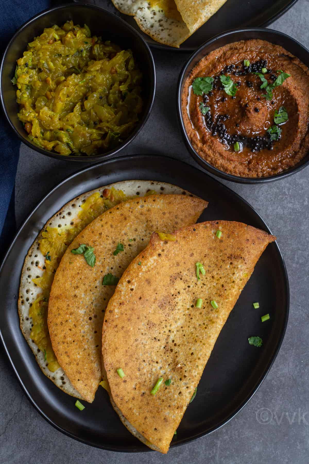 overhead shot of lauki masala dosa with chutney and the filling on the side
