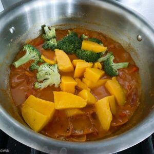 adding broccoli and mango