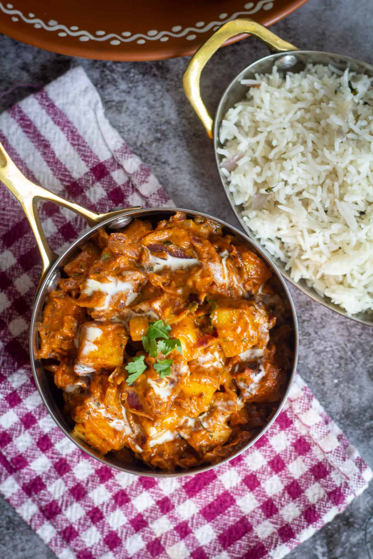 easy paneer do pyaza served in kadai with rice on the side