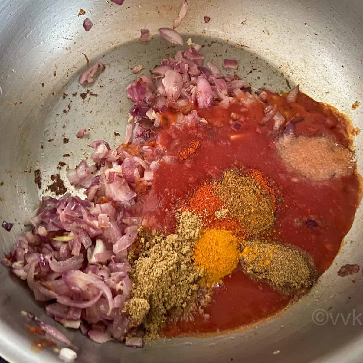 adding the tomato paste and spices