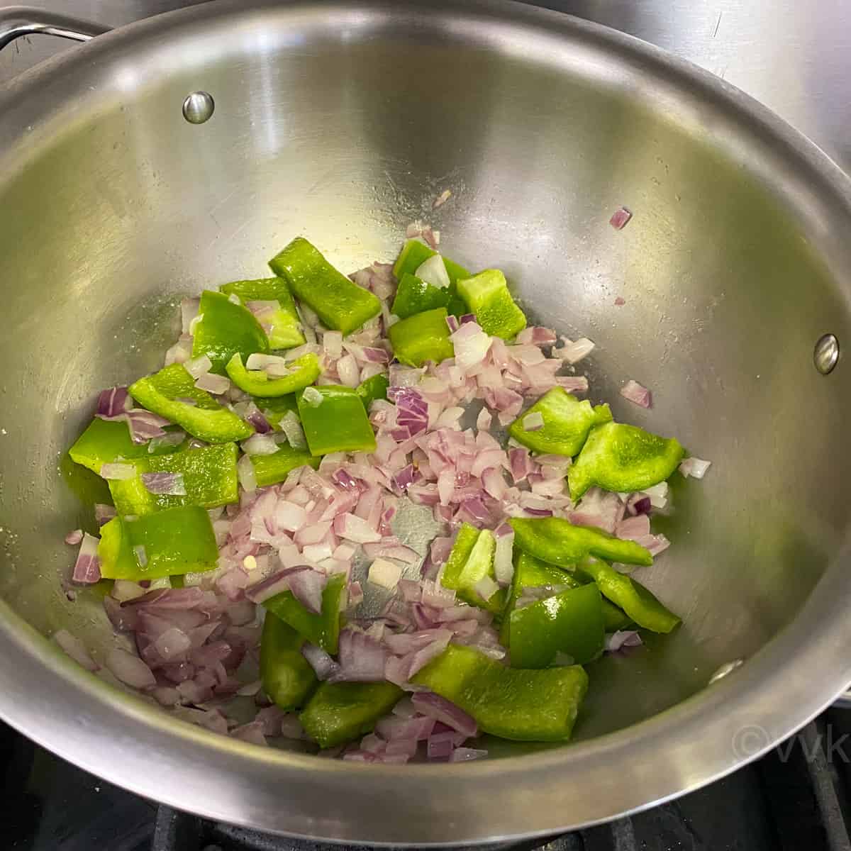 adding chopped capsicum