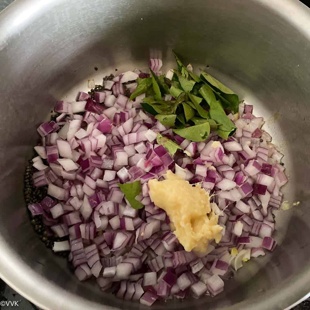 cooking onions, ginger garlic paste and curry leaves