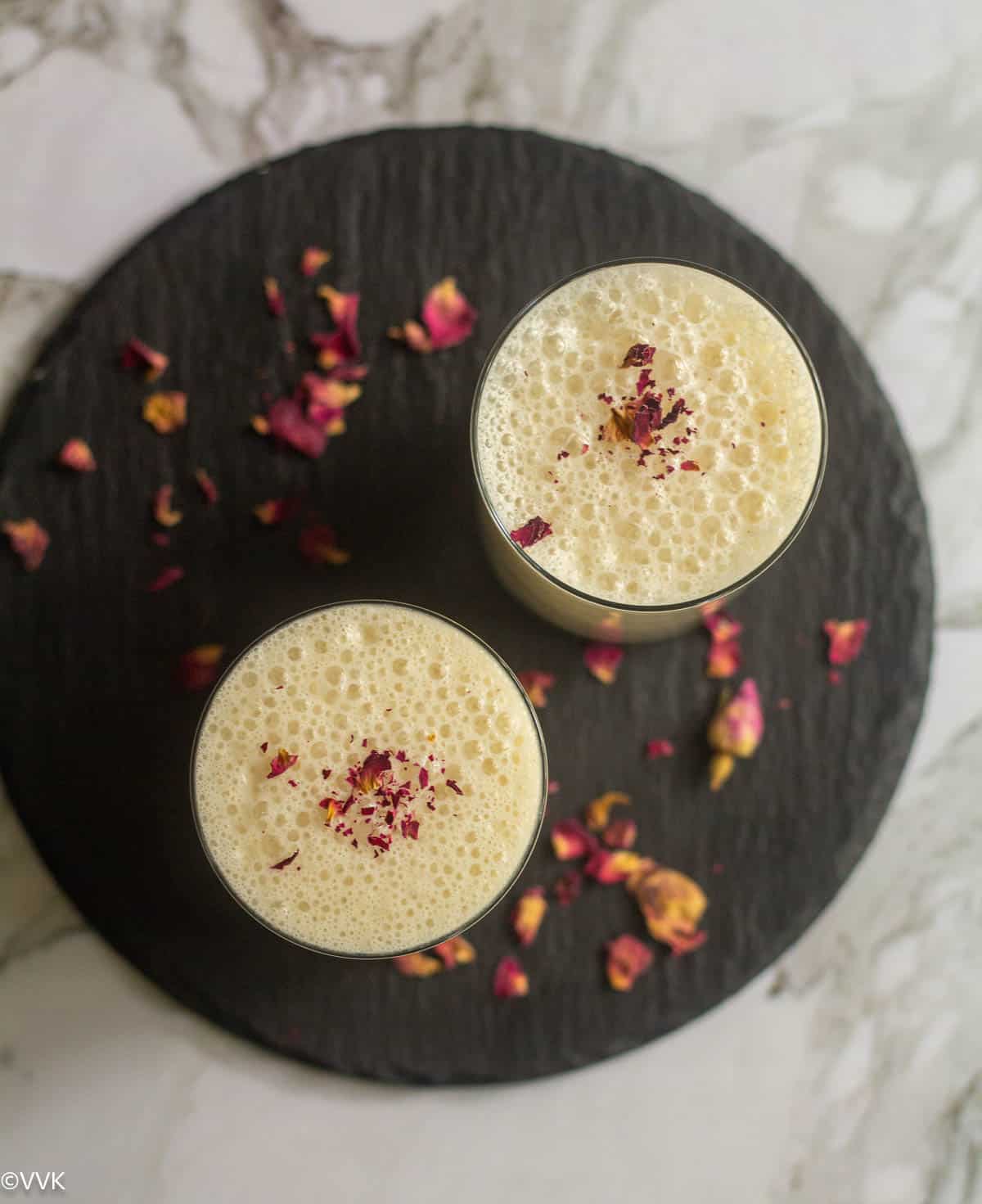 overhead shot of dates lassi served in black slate board