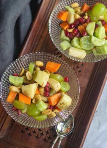 indian style fruit salad served in two glass bowls