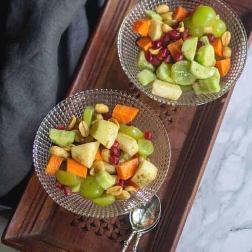 indian style fruit salad served in two glass bowls
