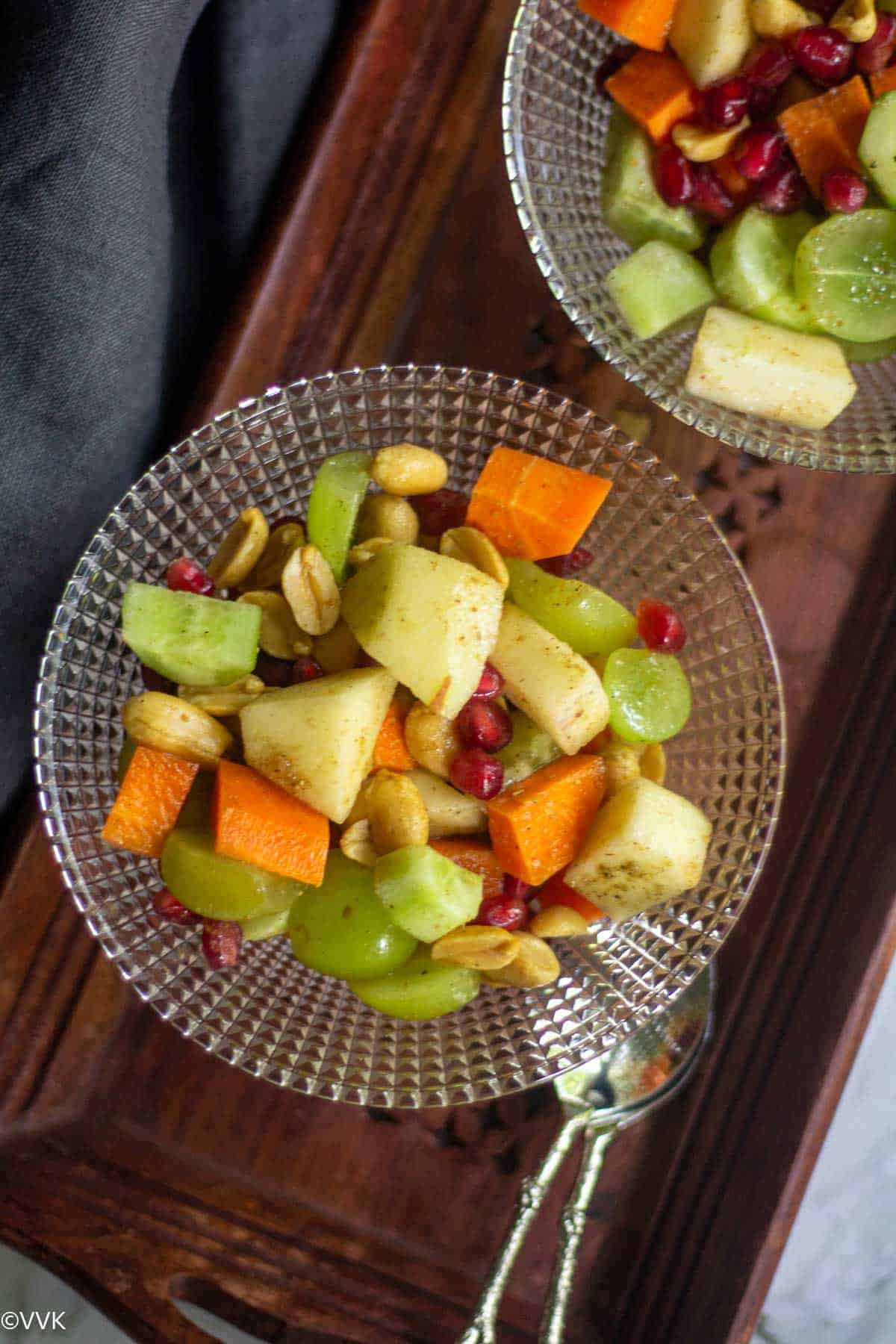 close up shot of fruit salad served in glass bowl