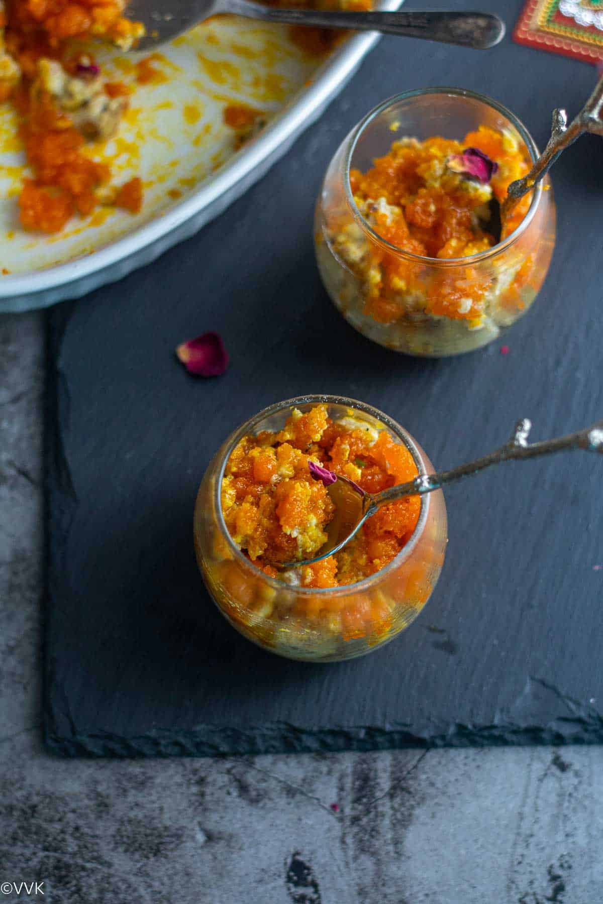 baked boondi pudding served in two small jars placed on black board