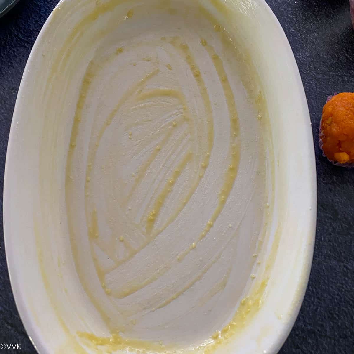 greasing the baking dish with ghee
