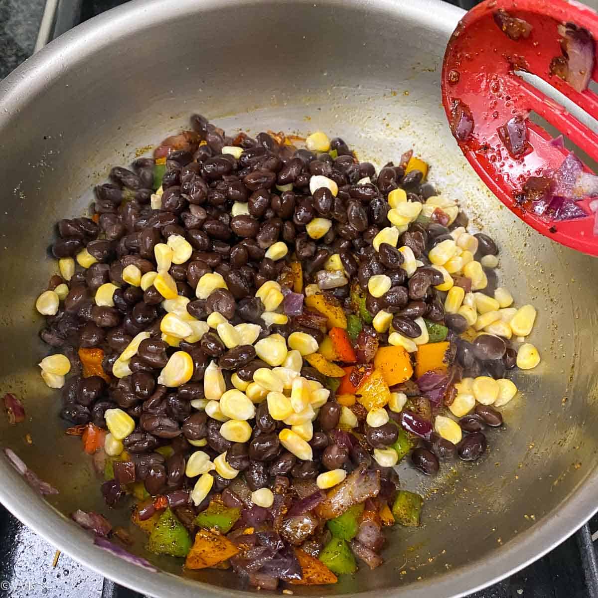 adding beans and corn