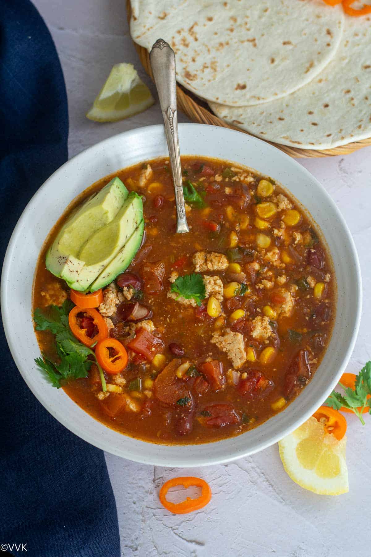 overhead shot of vegetarian taco soup served in white bowl
