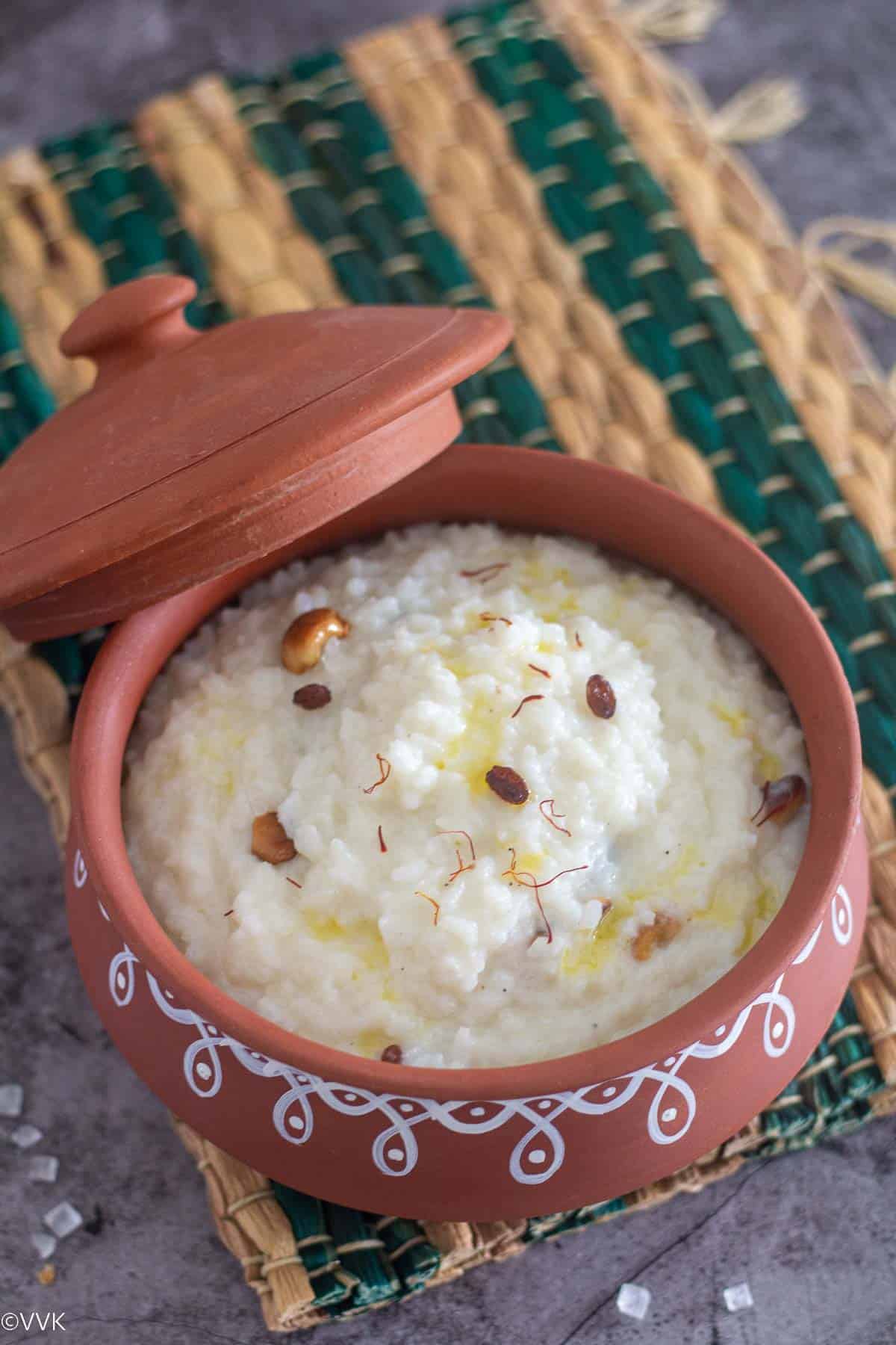 close up show of sugar candy rice served in clay pot placed on a mat