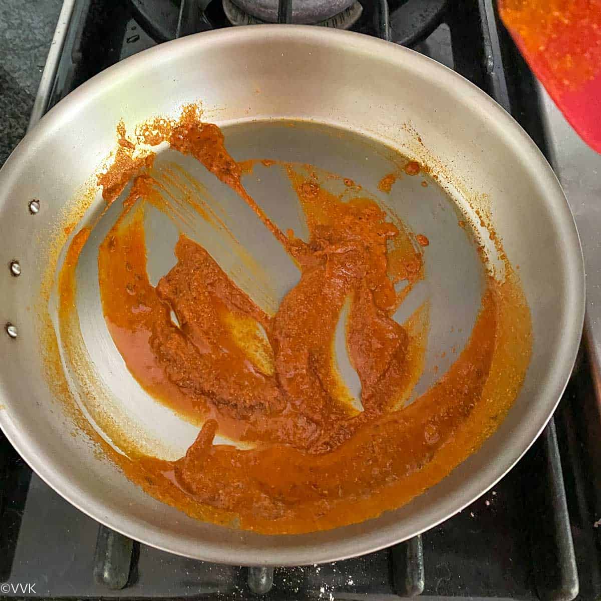 adding splash of water to the spices