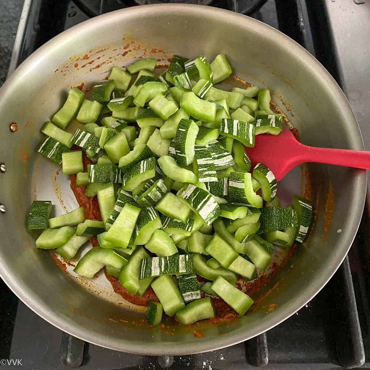 adding chopped snaked gourd