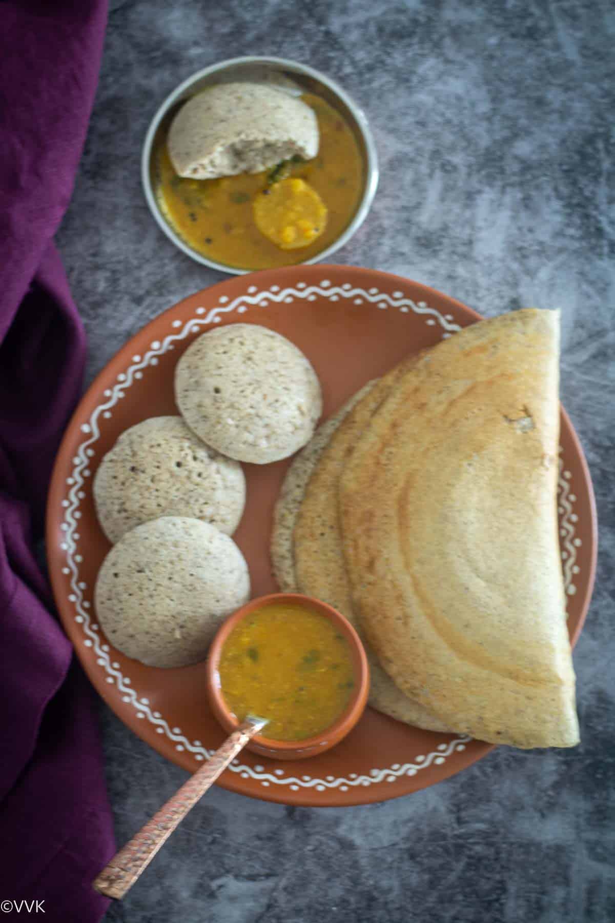 overhead shot of millet idli dosa with sambar