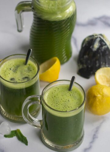 limonana served in two glasses and in a pitcher