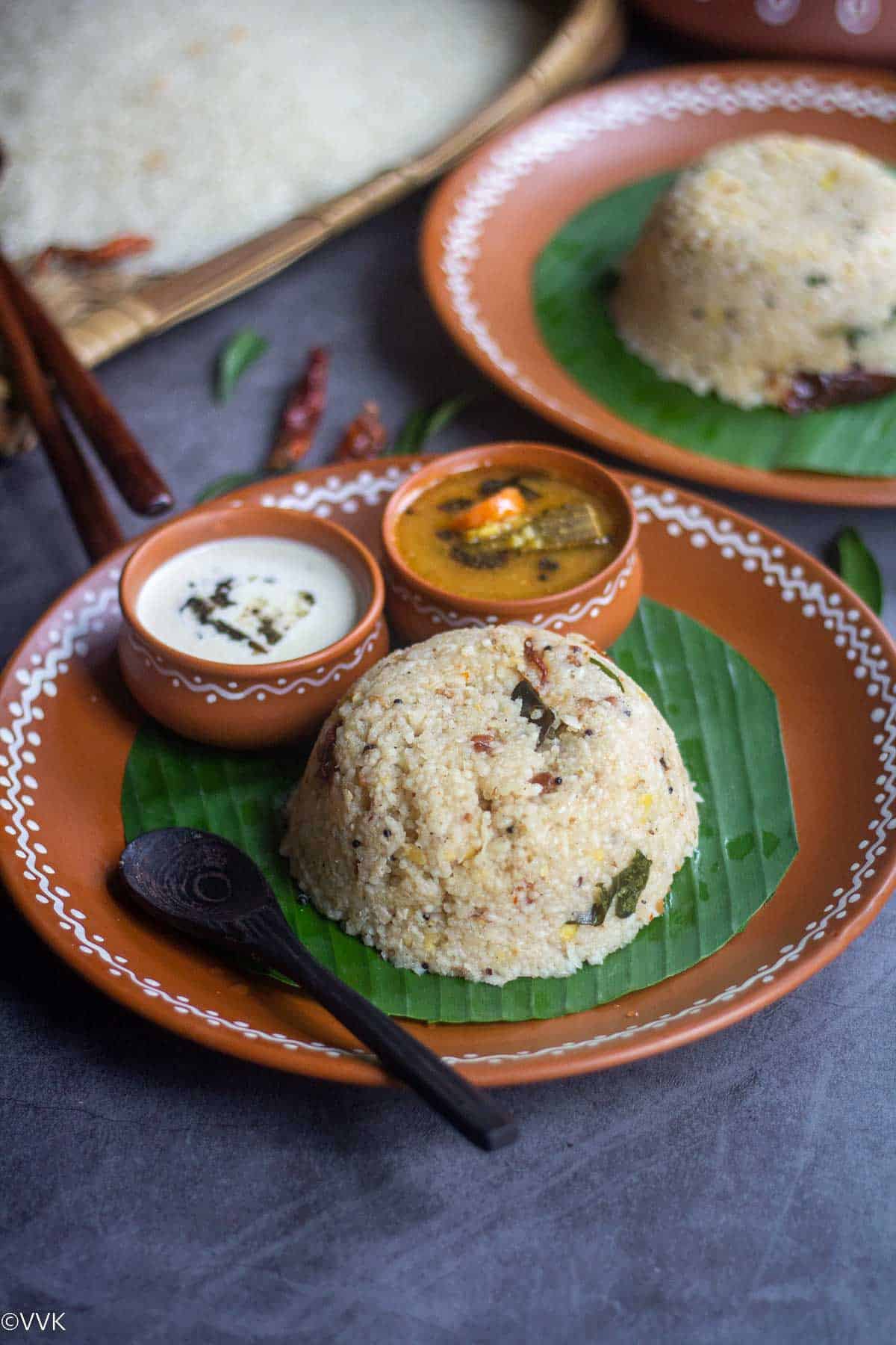 arisi upma served on banana leaf with chutney and sambar