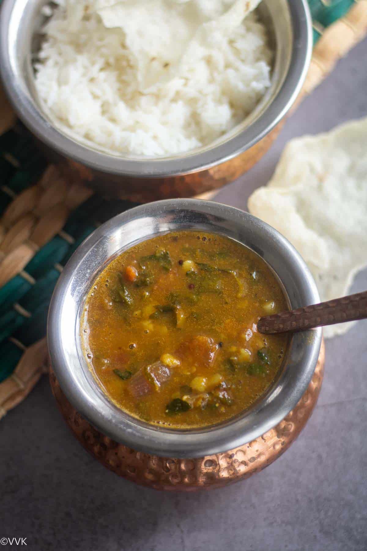 close up shot of methi sambar served with rice