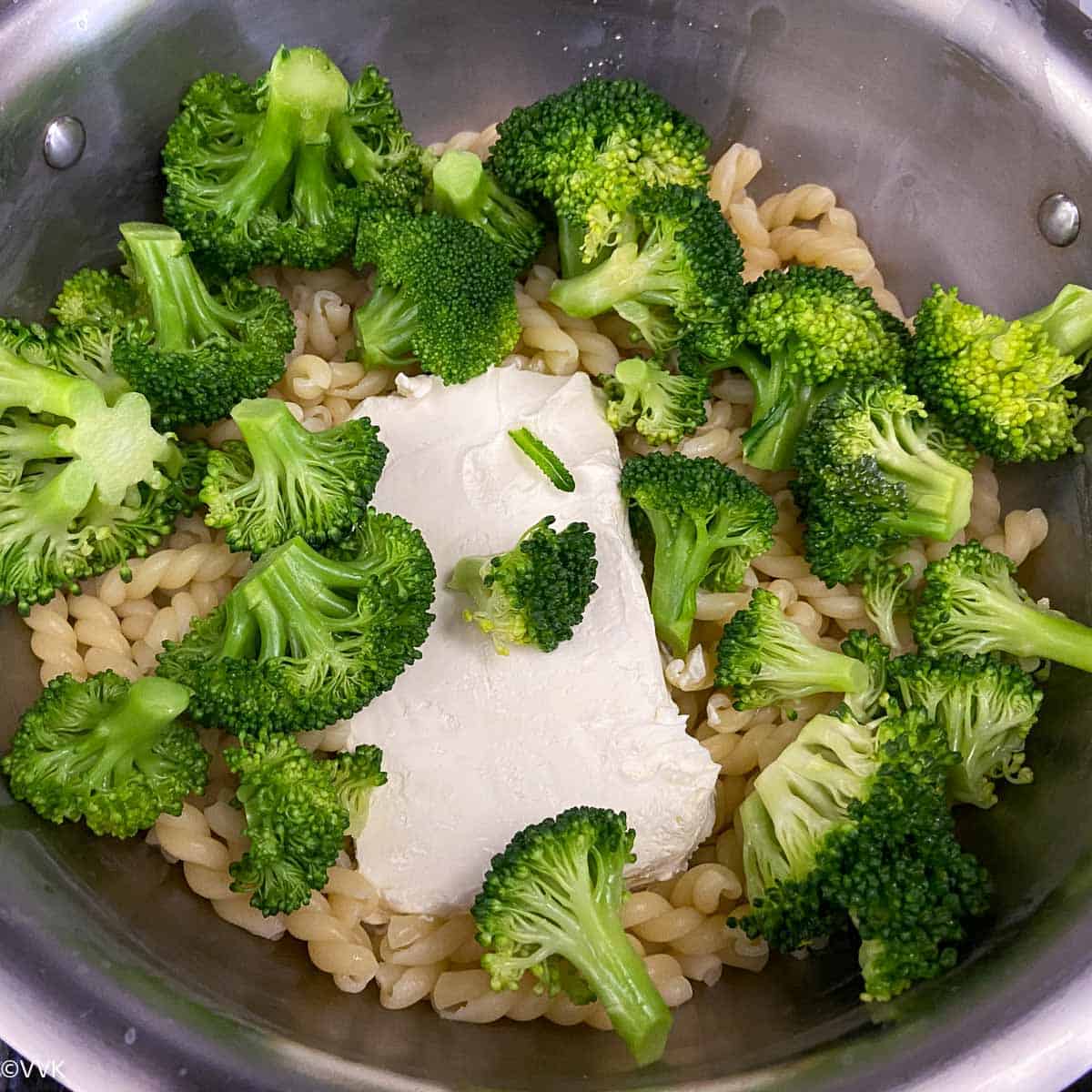 adding cream cheese and broccoli