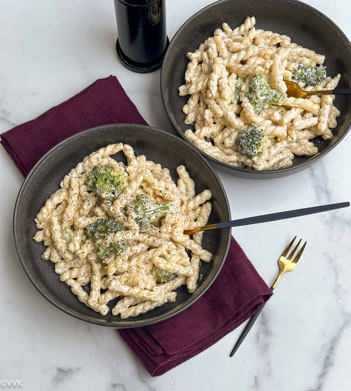 broccoli cream cheese pasta served in two bowls