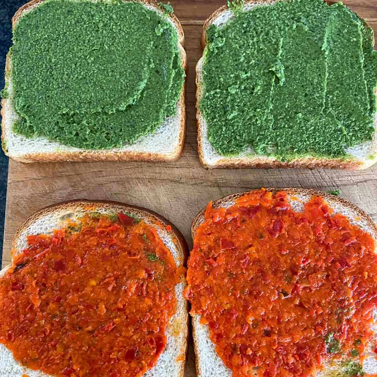 spreading the sauce on the sandwich