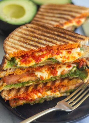 square image of pesto sandwich stacked