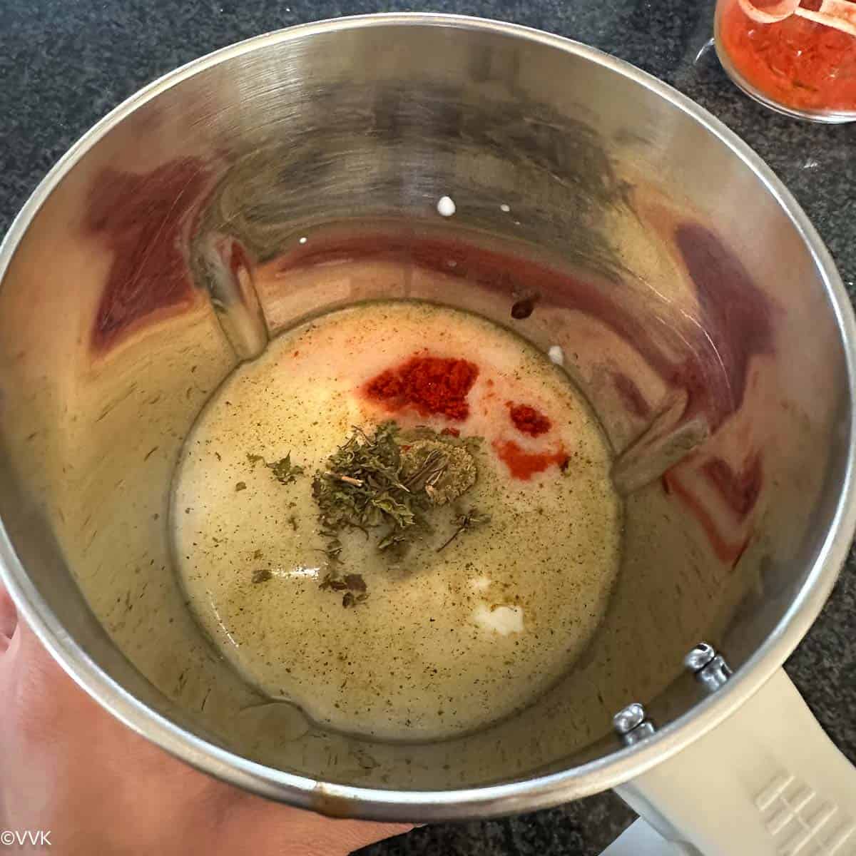 adding all the ingredients to the blender