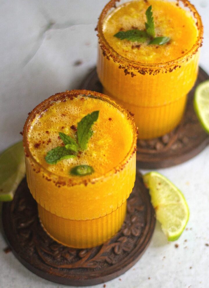 square image of mango ginger ale mocktail served in two glasses