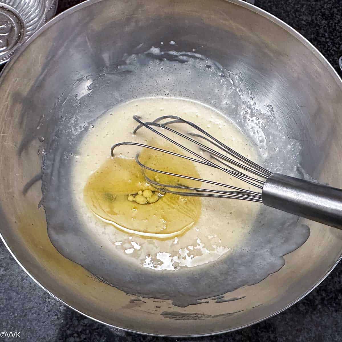 adding the oil to sugar mix