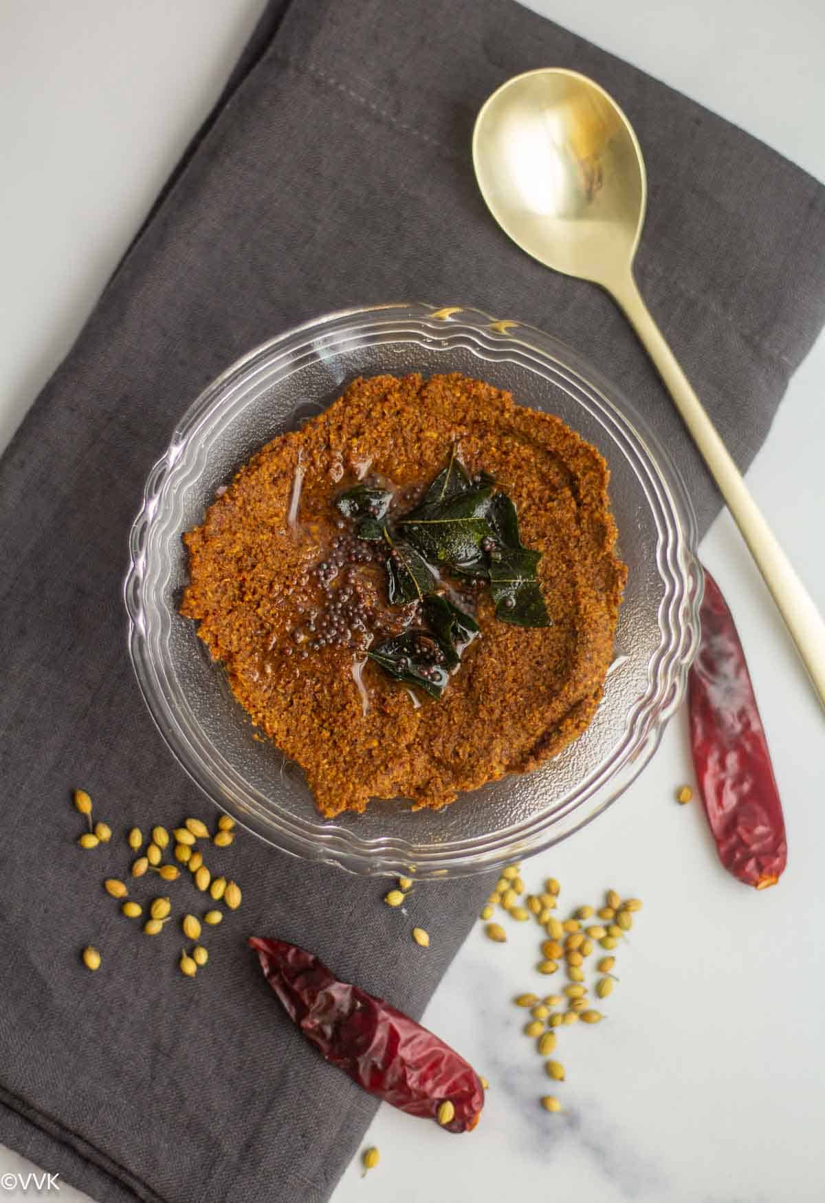 overhead shot of coriander seeds chutney placed on gray towel