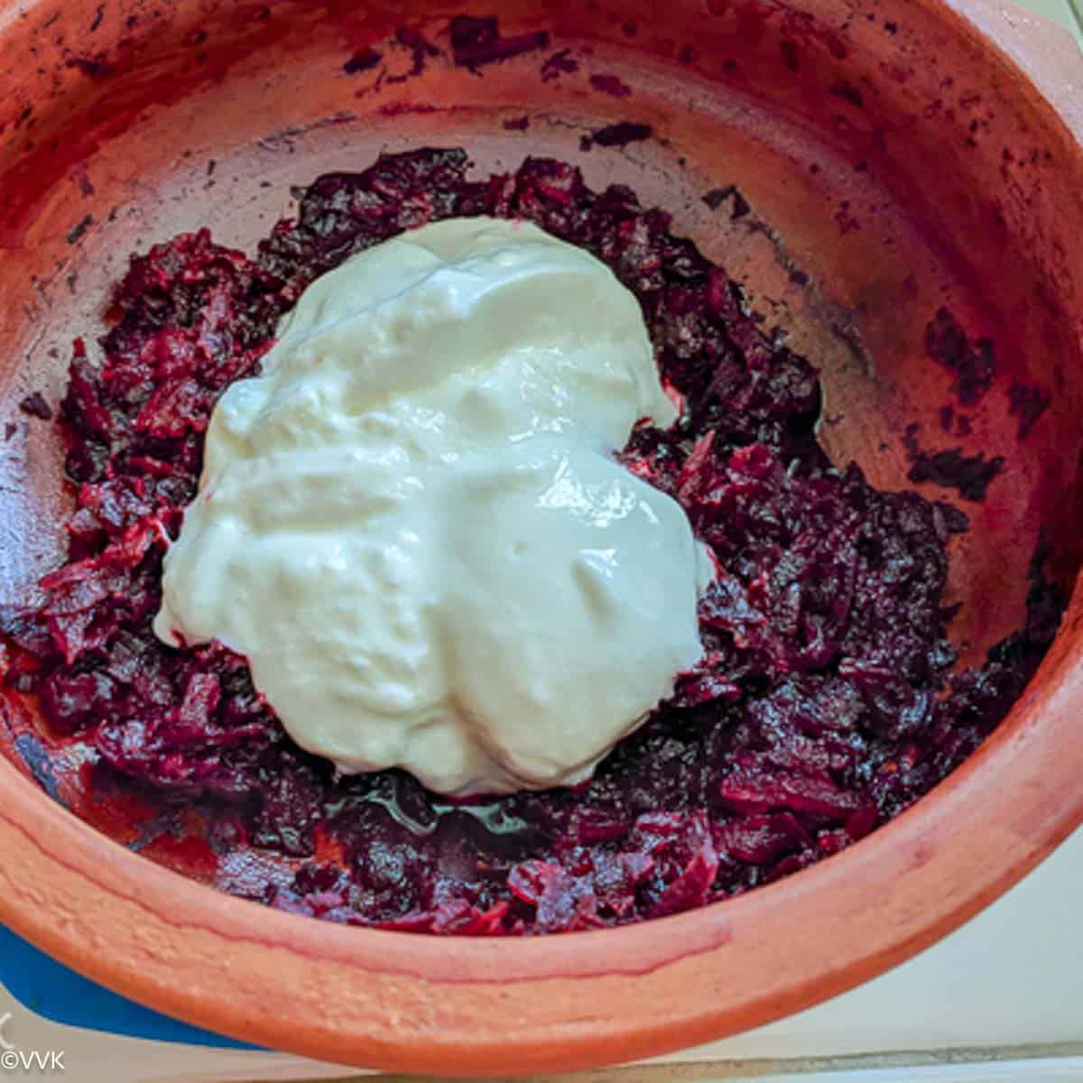 adding yogurt to the cooked beets