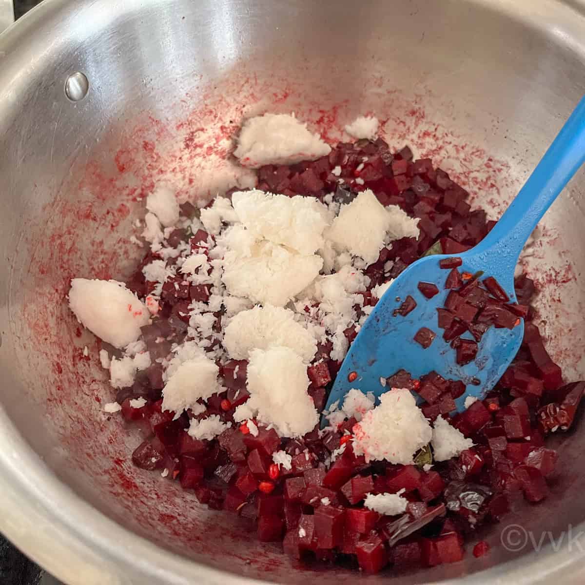 adding coconut to the south indian beetroot stirfry