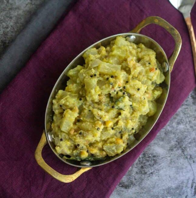 square image of pappali kai kootu served in brass serve ware