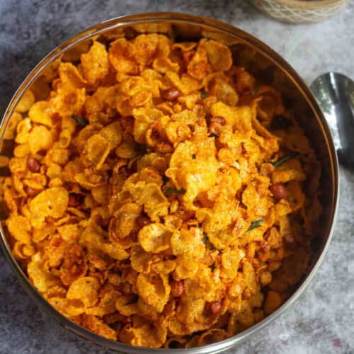corn poha mixture served in stainless steel container
