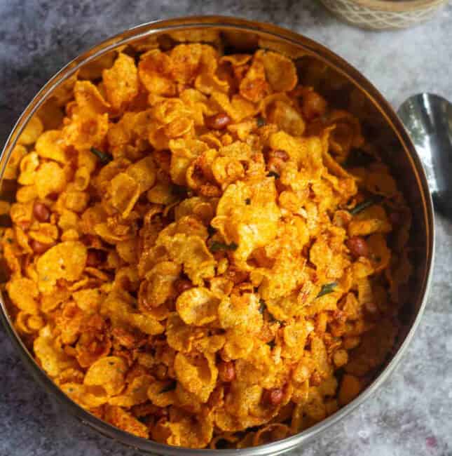 corn poha mixture served in stainless steel container