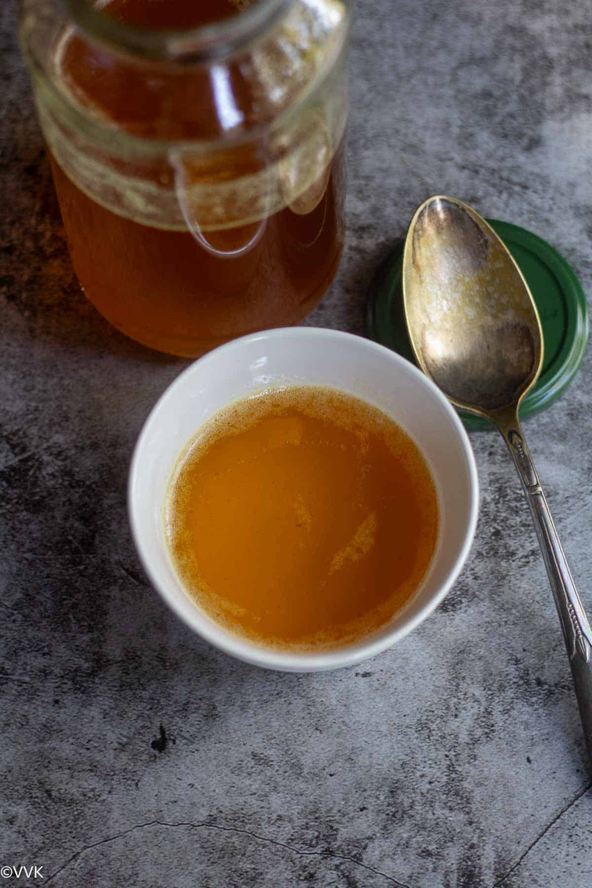 melted ghee in white bowl
