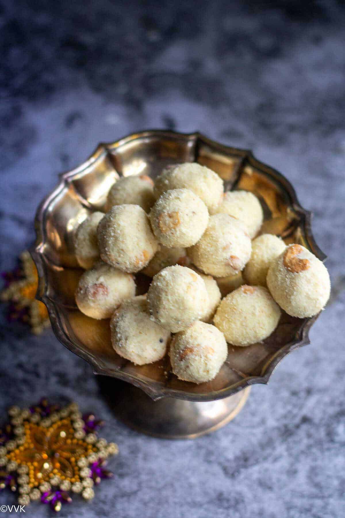 semolina laddy stacked on a silver plate and shot in slanting way